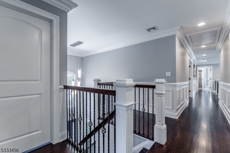 1831 Washington Valley Road Bridgewater, NJ 08836 - Photo 18 of 43 a view of a hallway with wooden floor and windows
