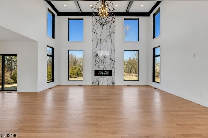 1831 Washington Valley Road Bridgewater, NJ 08836 - Photo 5 of 43 a view of a big room with wooden floor chandelier and windows