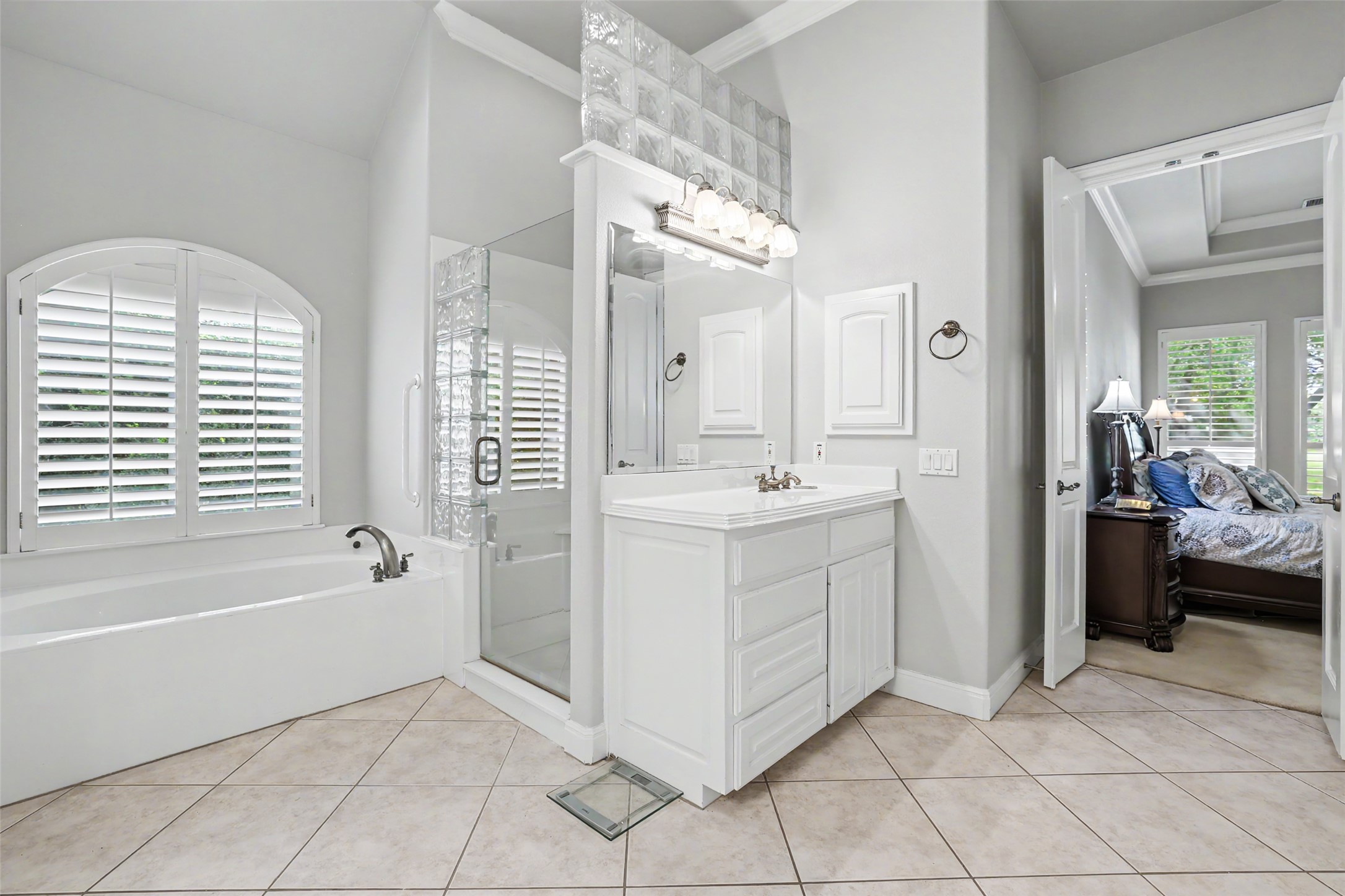 33 Meadows End Georgetown, TX 78628 - Photo 21 of 40 Indulge in a tranquil primary bathroom offering a separate tub and a sleek glass-enclosed shower.