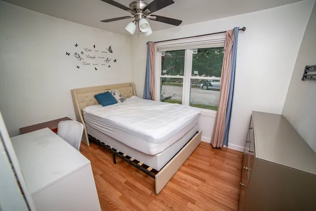 a bedroom with a bed and a table