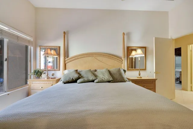 a bedroom with a large bed and a couch