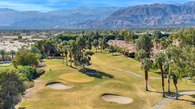 a view of a swimming pool with a yard