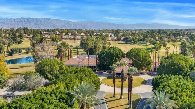a view of a swimming pool with sitting area