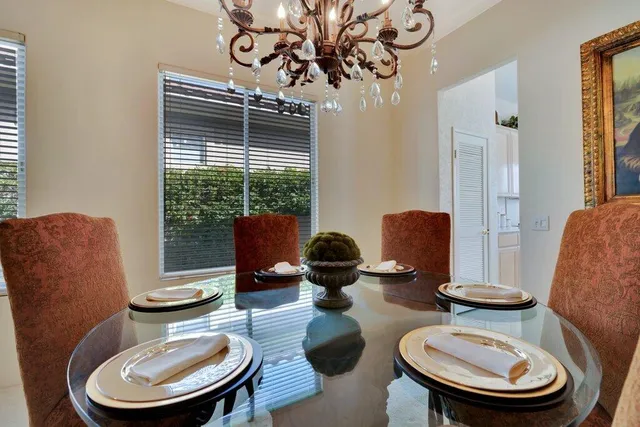 a living room with furniture a rug and a window