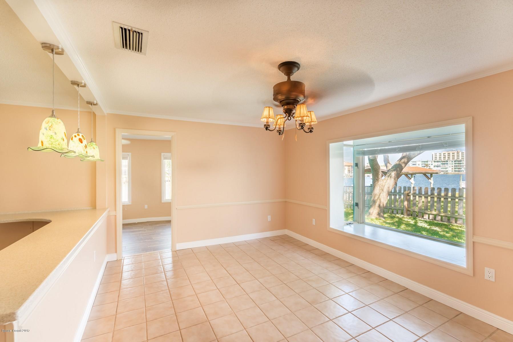 205 Bimini Road Cocoa Beach, FL 32931 - Photo 18 of 28 Dining area with views of water