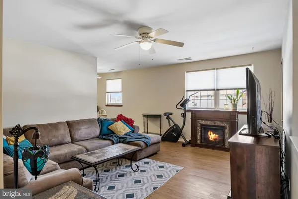 a living room with furniture and a rug