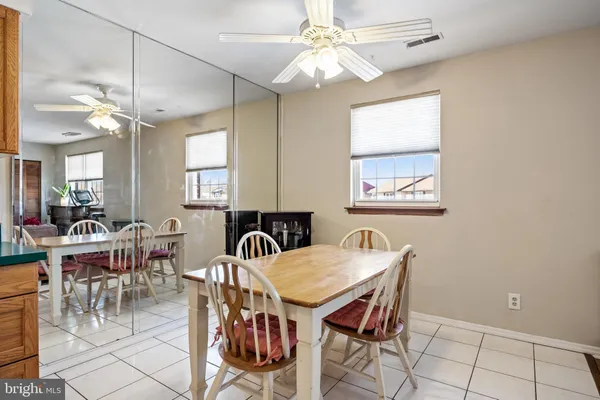 a kitchen with a sink a stove a refrigerator and cabinets