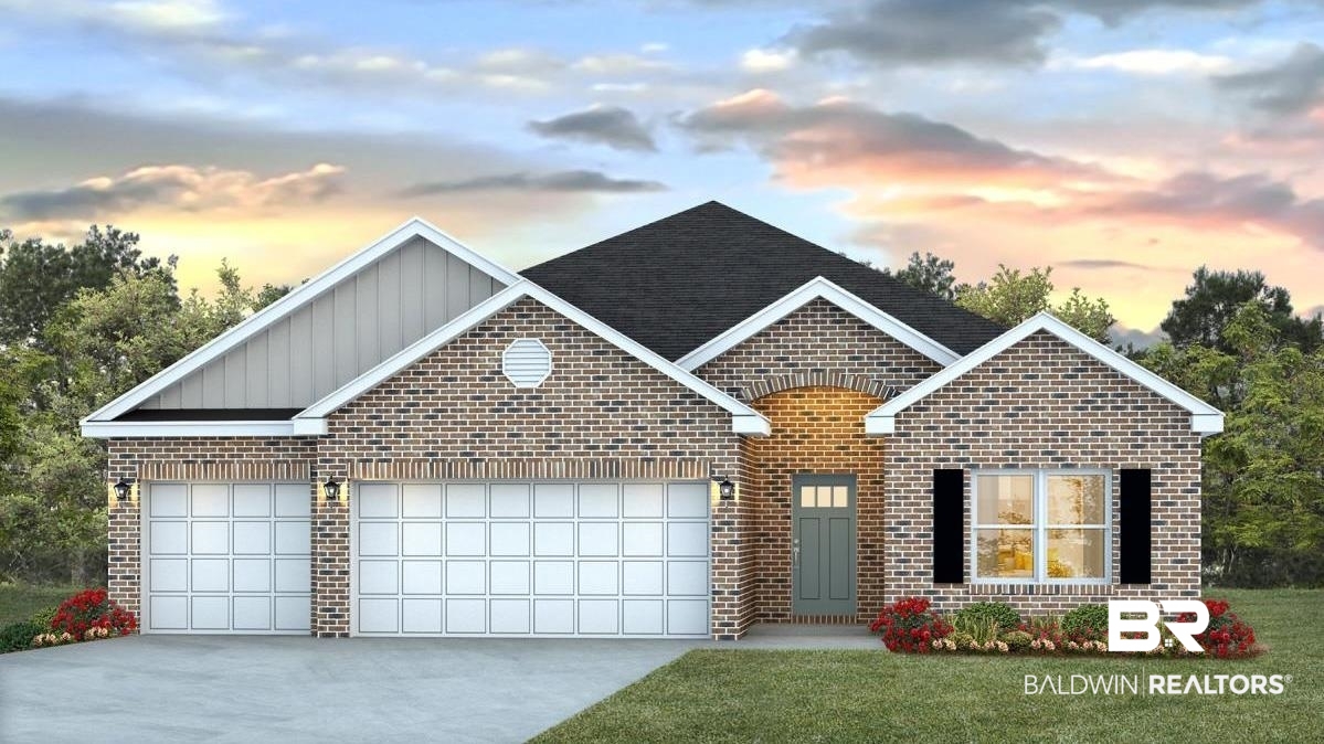 329 Barndling Street Fairhope, AL 36532 - Photo 1 of 1 View of front facade featuring a garage and a lawn