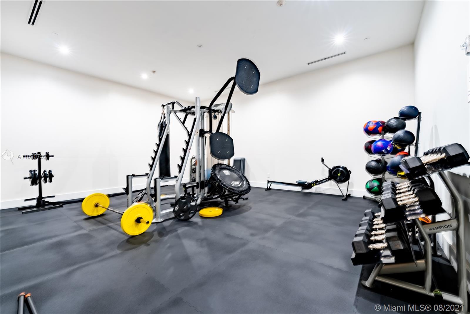 801 Brickell Key Boulevard, Unit 806 Miami, FL 33131 - Photo 20 of 20 a view of a room with gym equipment