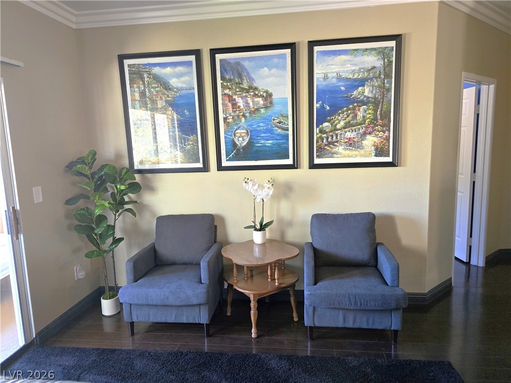2050 West Warm Springs Road, Unit 2422 Henderson, NV 89014 - Photo 10 of 44 This inviting corner features rich hardwood flooring and elegant crown molding.