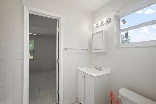 a bathroom with a bathtub a shower a sink and vanity