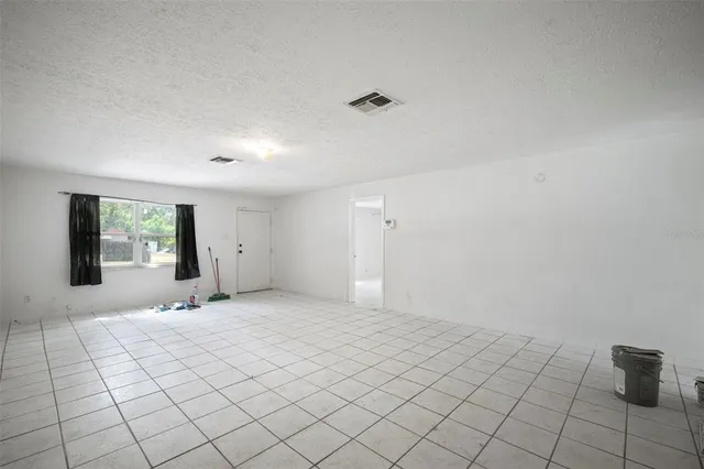 a view of an empty room and window