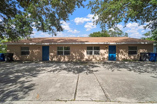 an empty room with a ceiling fan and window