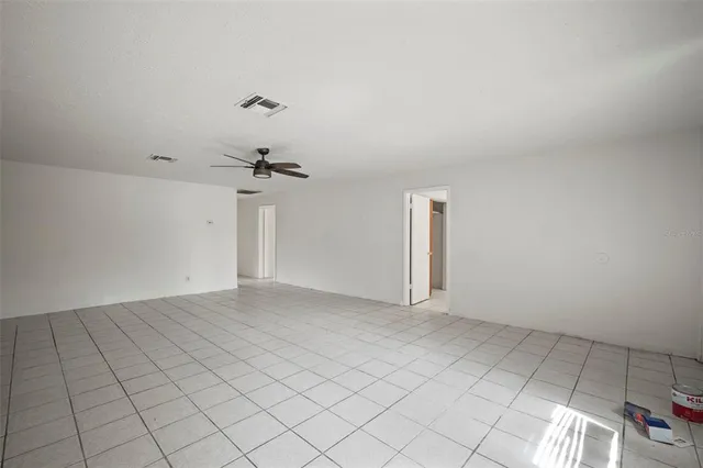 a view of an empty room and window