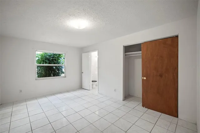 a kitchen with sink cabinets and window