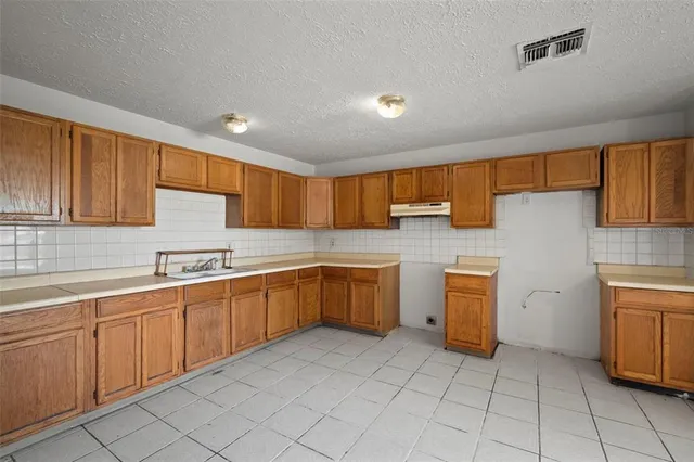 a view of room with cabinets