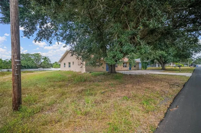 a view of a swimming pool with an outdoor space and seating area