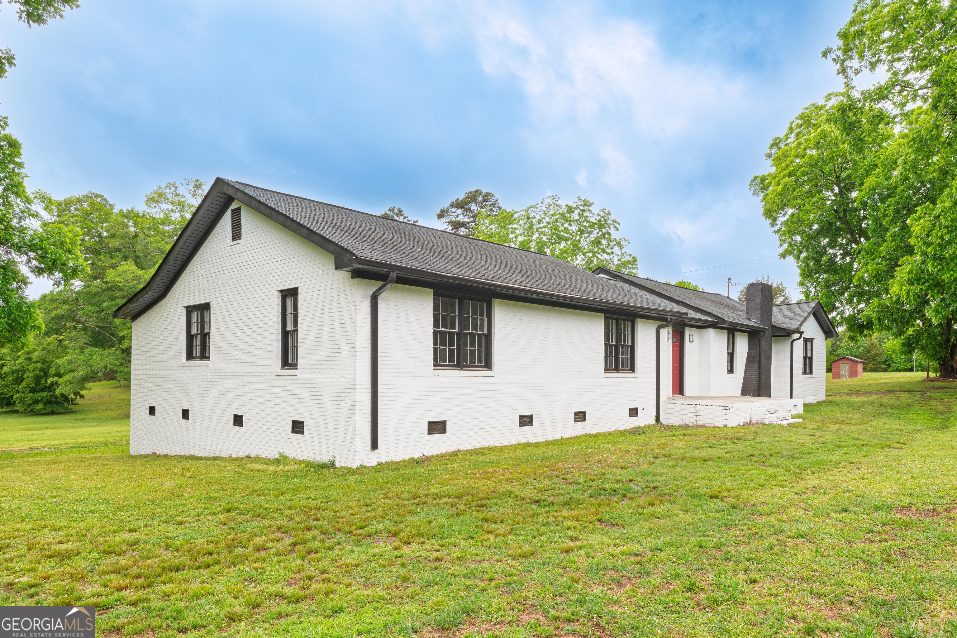 418 Lamb Road Moreland, GA 30259 - Photo 2 of 32 a view of a house with a yard