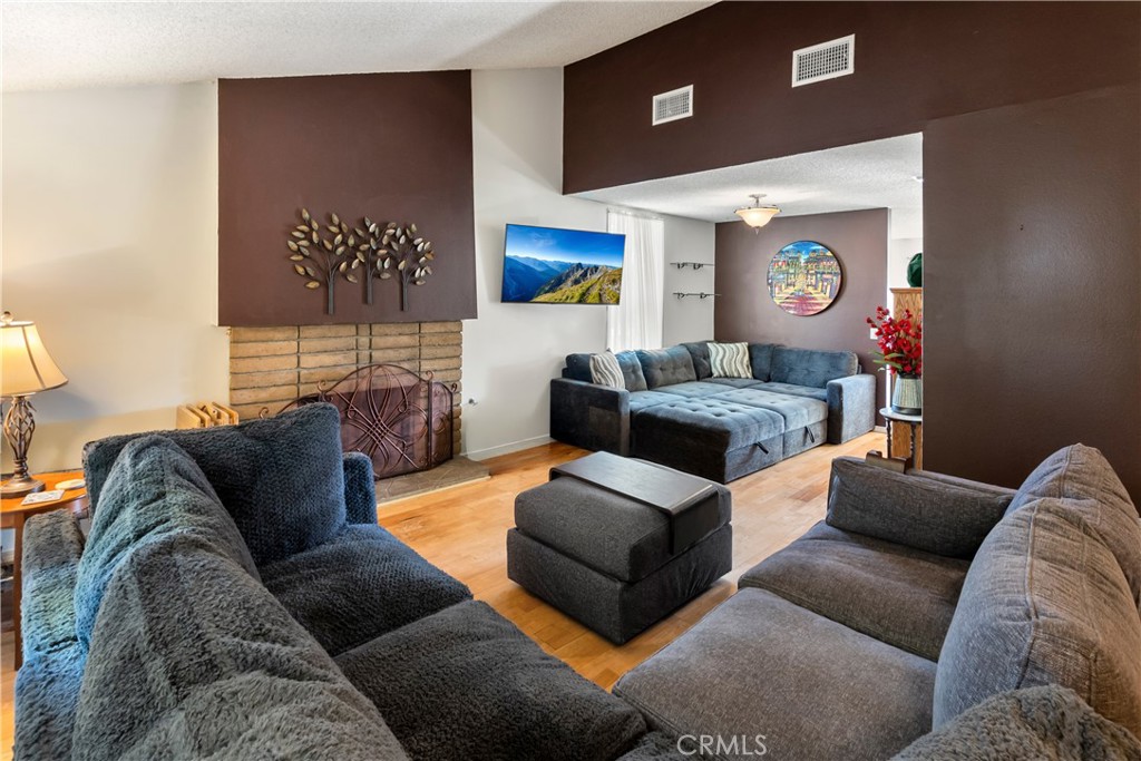 6624 Banyan Place Riverside, CA 92506 - Photo 10 of 41 Living room with natural gas fireplace and secondary dining/flex space