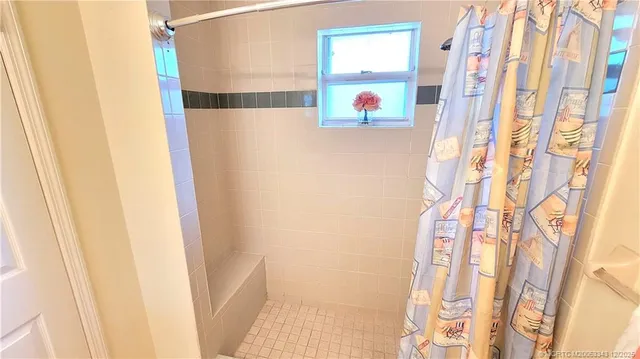 a bathroom with a bathtub and shower