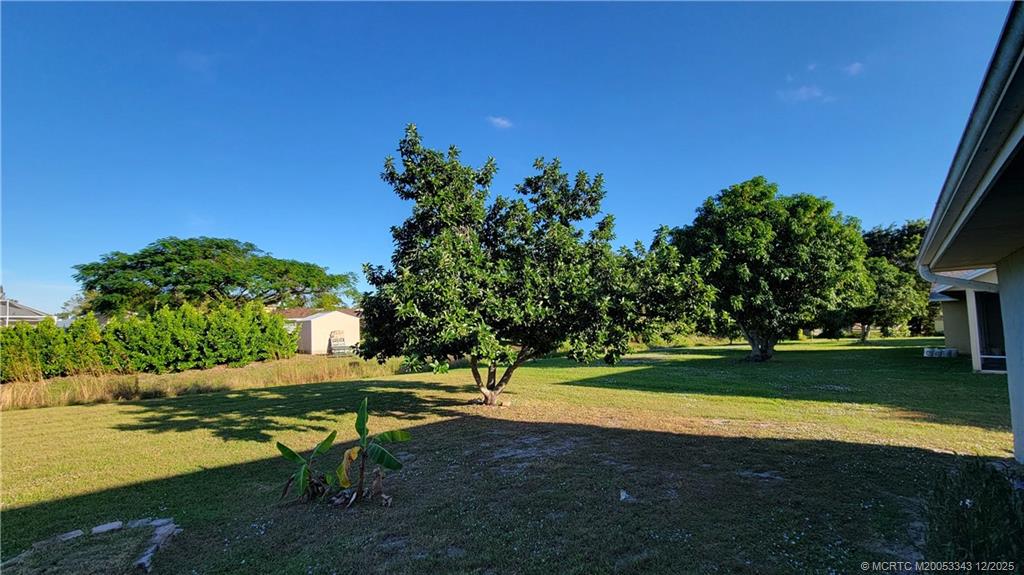 2149 Southeast Dolphin Road Port St. Lucie, FL 34952 - Photo 20 of 25 a view of a park with large trees