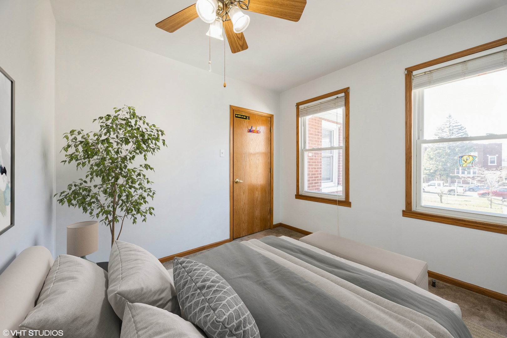 1309 Maple Avenue Berwyn, IL 60402 - Photo 14 of 17 a bedroom with a bed and a chandelier