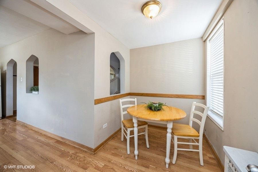 1309 Maple Avenue Berwyn, IL 60402 - Photo 8 of 17 a view of a dining room with furniture and wooden floor