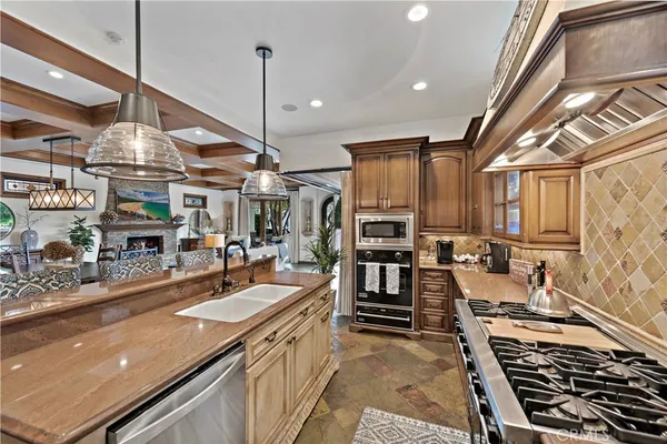 a kitchen that has a table chairs and a wooden floor