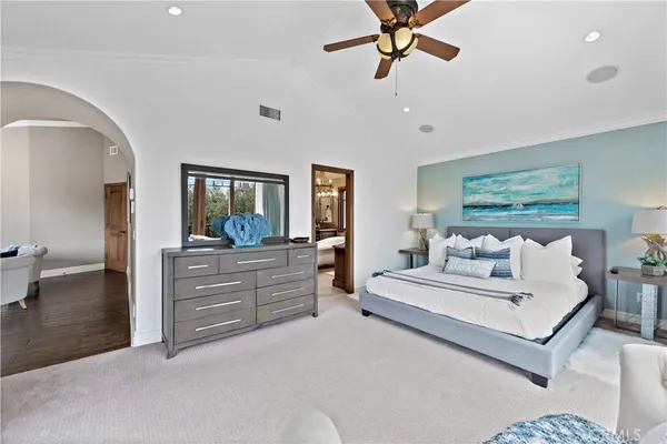 a large spacious bathroom with a double vanity sink a mirror a bathtub and shower