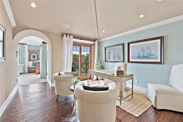 a spacious bedroom with a bed and a window