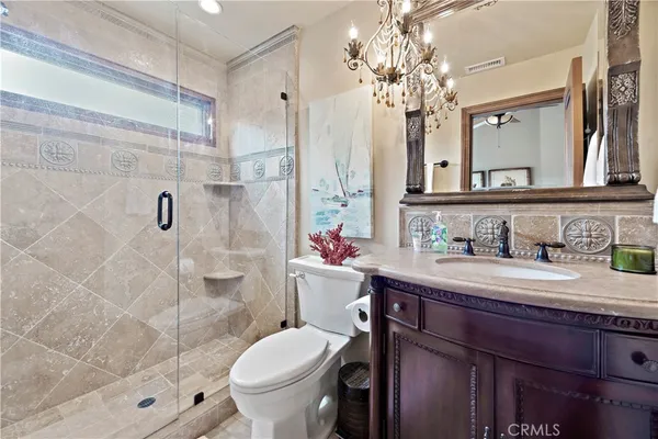 a front view of a house with potted plants
