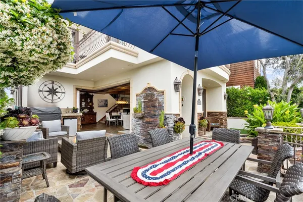 a living room with furniture a fireplace and a large window