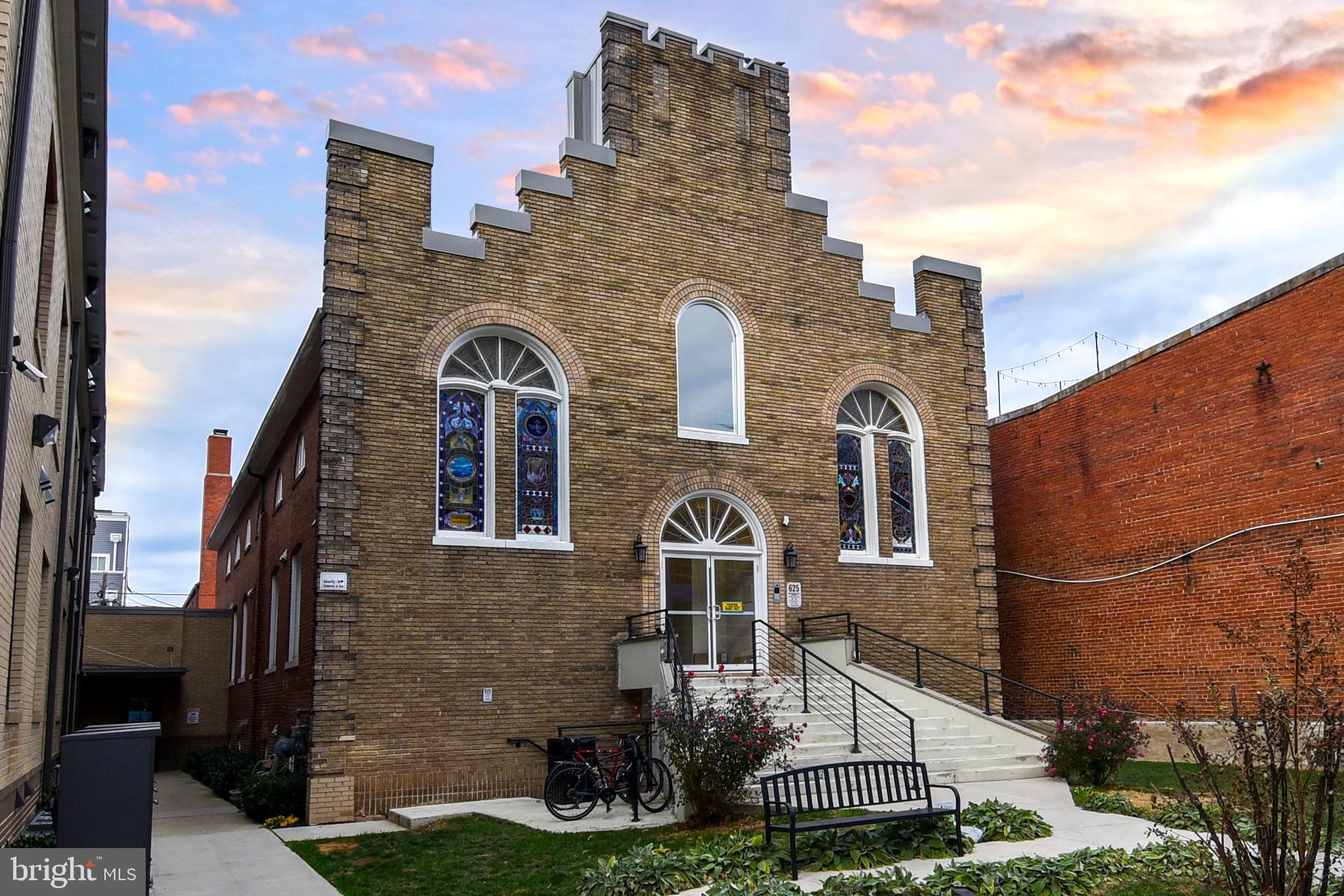 625 Park Road Northwest, Unit C8 Washington, DC 20010 - Photo 3 of 35 Historic brick building with vibrant stained gl...