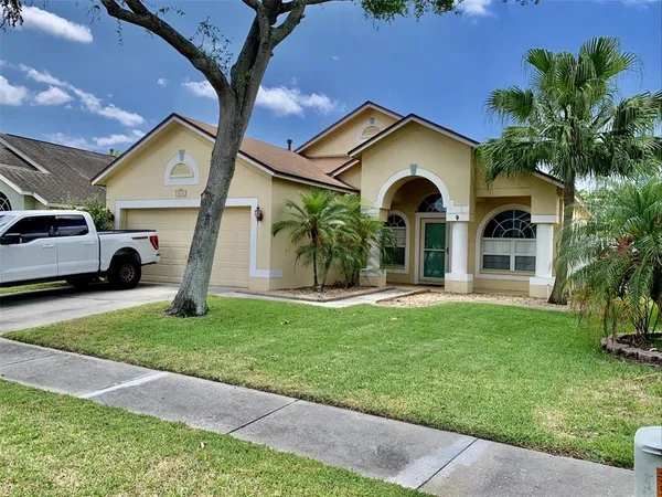 a view of a house with a yard