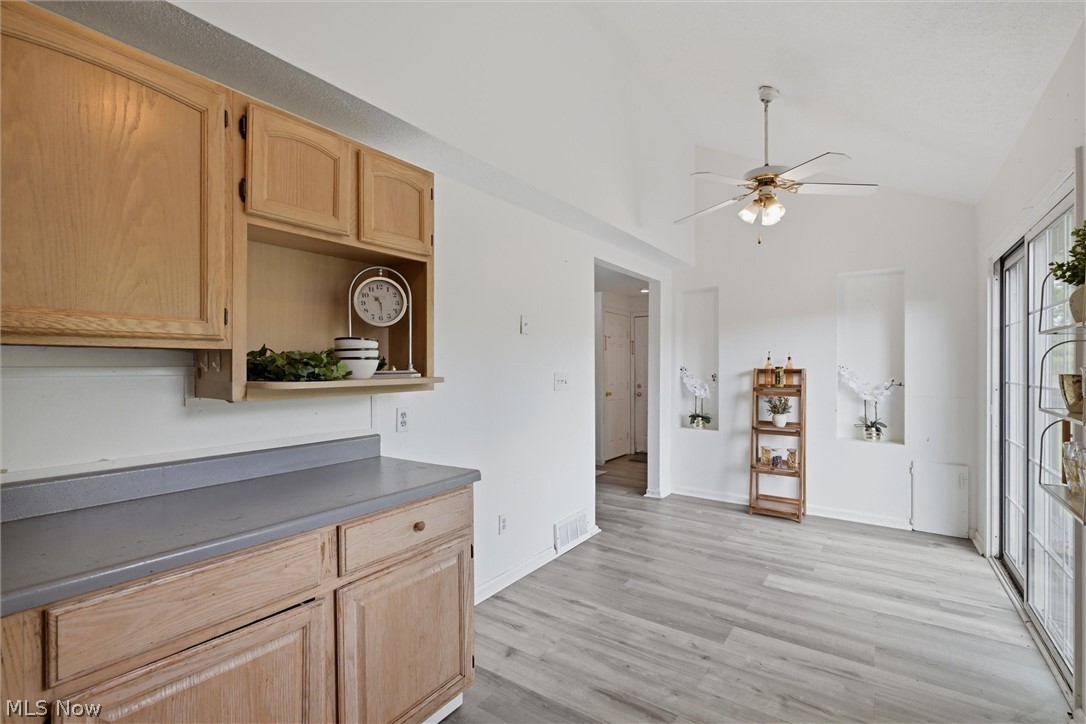 5860 Kirk Road Canfield, OH 44406 - Photo 12 of 17 White painted walls complement wood-finish cabinetry and gray countertop space