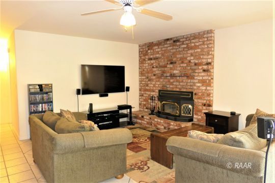 908 Randall Street Ridgecrest, CA 93555 - Photo 13 of 35 a living room with furniture and a flat screen tv