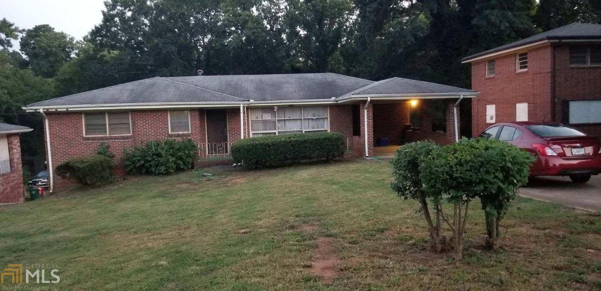 2305 Miriam Lane, Unit 25 Decatur, GA 30032 - Photo 1 of 1 a front view of a house with garden