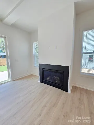 a room with a bed and a window