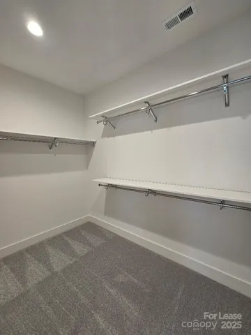 a view of an empty walk in closet