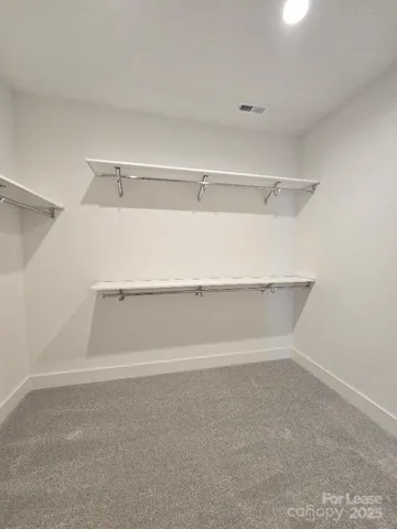 a view of an empty walk in closet