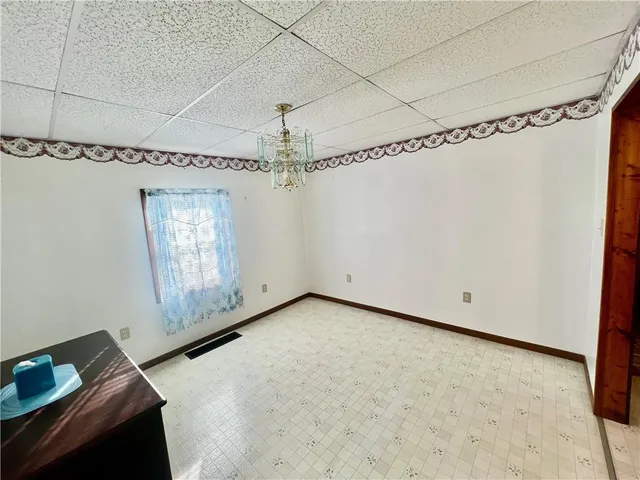 a room with furniture and a flat screen tv
