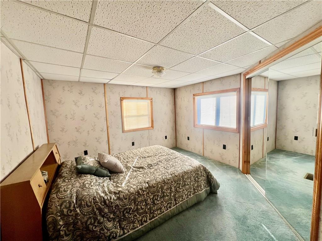 221 Expedite Road Twin Rocks, PA 15960 - Photo 14 of 27 a bed sitting in a spacious bedroom next to a window