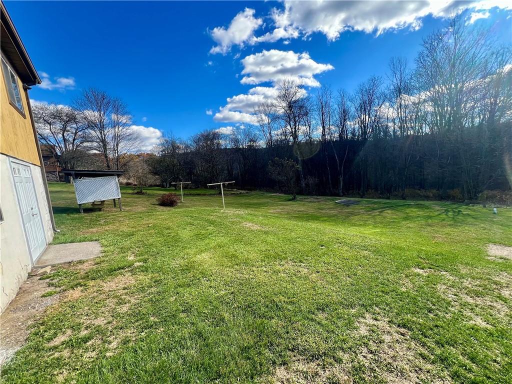 221 Expedite Road Twin Rocks, PA 15960 - Photo 19 of 27 a view of a yard with a house in the background