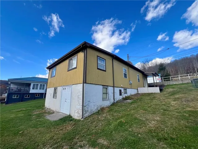 a view of a house with a swimming pool