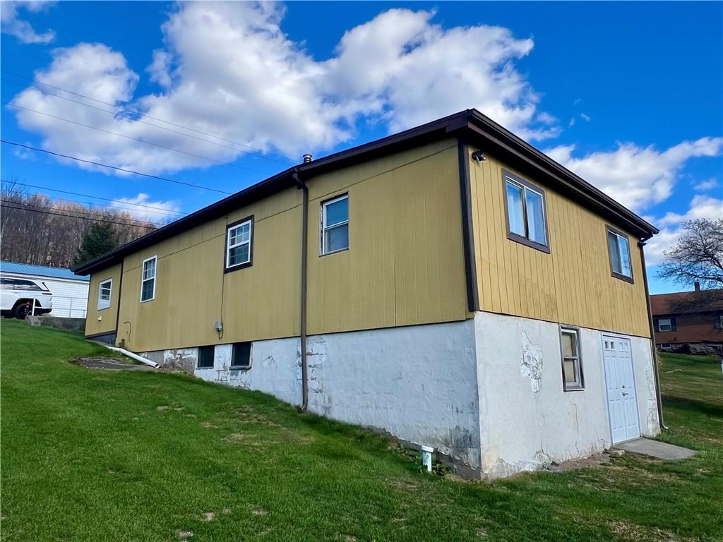221 Expedite Road Twin Rocks, PA 15960 - Photo 26 of 27 a view of an house with backyard space and balcony