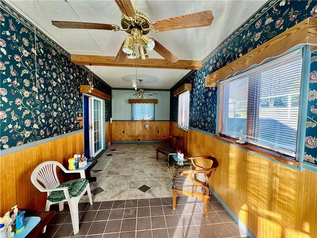 a view of a lobby with furniture and chandelier