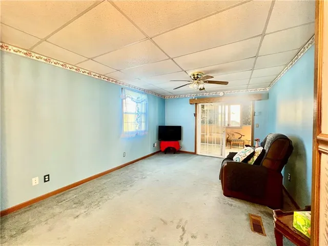 a kitchen with stainless steel appliances granite countertop a refrigerator a stove a sink dishwasher and a refrigerator with wooden cabinets