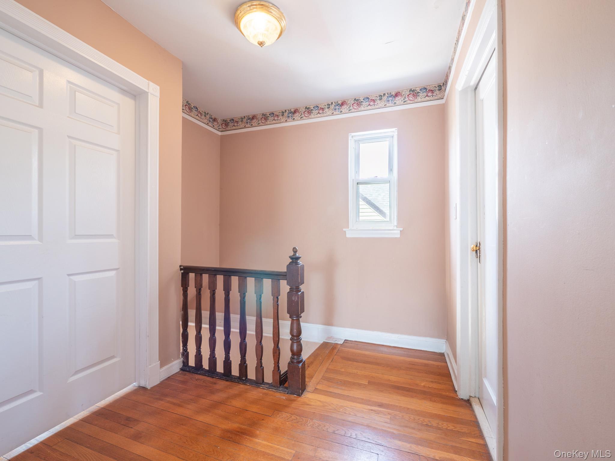 75-75 180th Street Queens, NY 11366 - Photo 19 of 48 a view of entryway with wooden floor