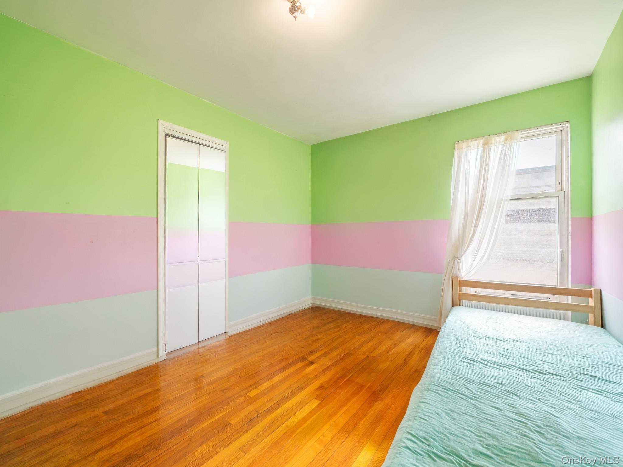 75-75 180th Street Queens, NY 11366 - Photo 26 of 48 a view of an empty room with wooden floor