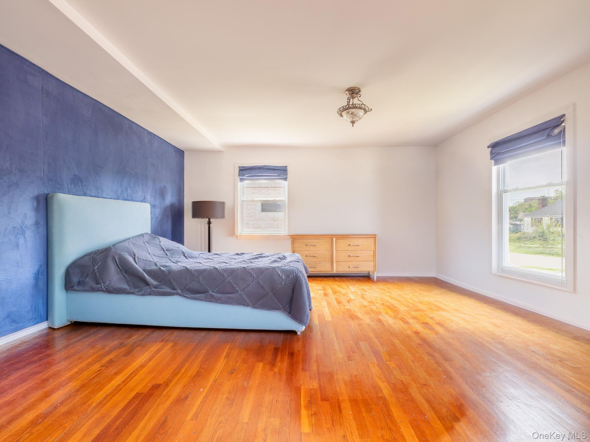 75-75 180th Street Queens, NY 11366 - Photo 28 of 48 a bedroom with a bed and window